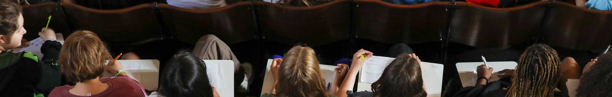 Stock Image of students with notebooks.